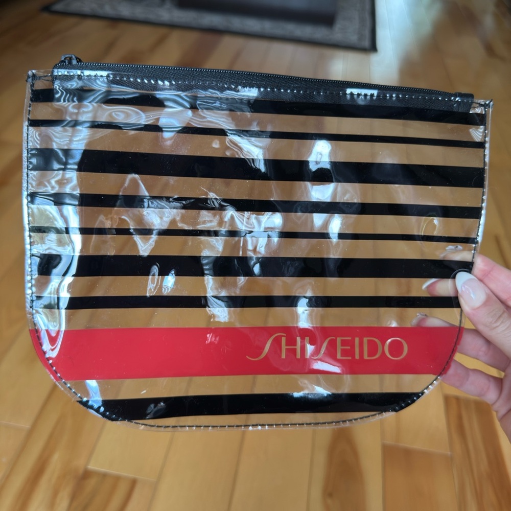 Shiseido Transparent Cosmetics Pouch with Black Stripes and Red Accent